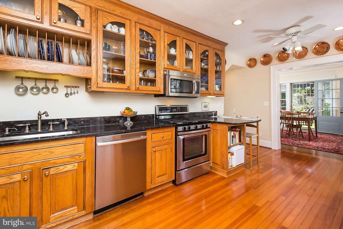 14 East Bishops Road Baltimore, MD 21218 - Photo 7 of 28 a kitchen with stainless steel appliances granite countertop a stove and a sink