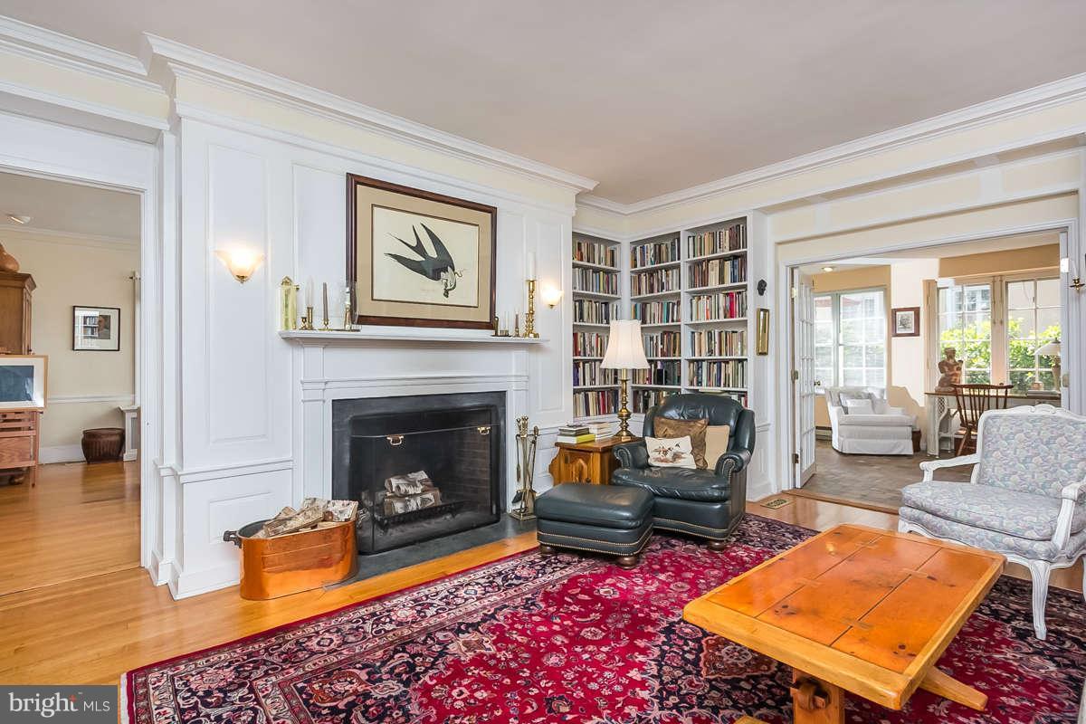 14 East Bishops Road Baltimore, MD 21218 - Photo 10 of 28 a living room with furniture a rug and a fireplace