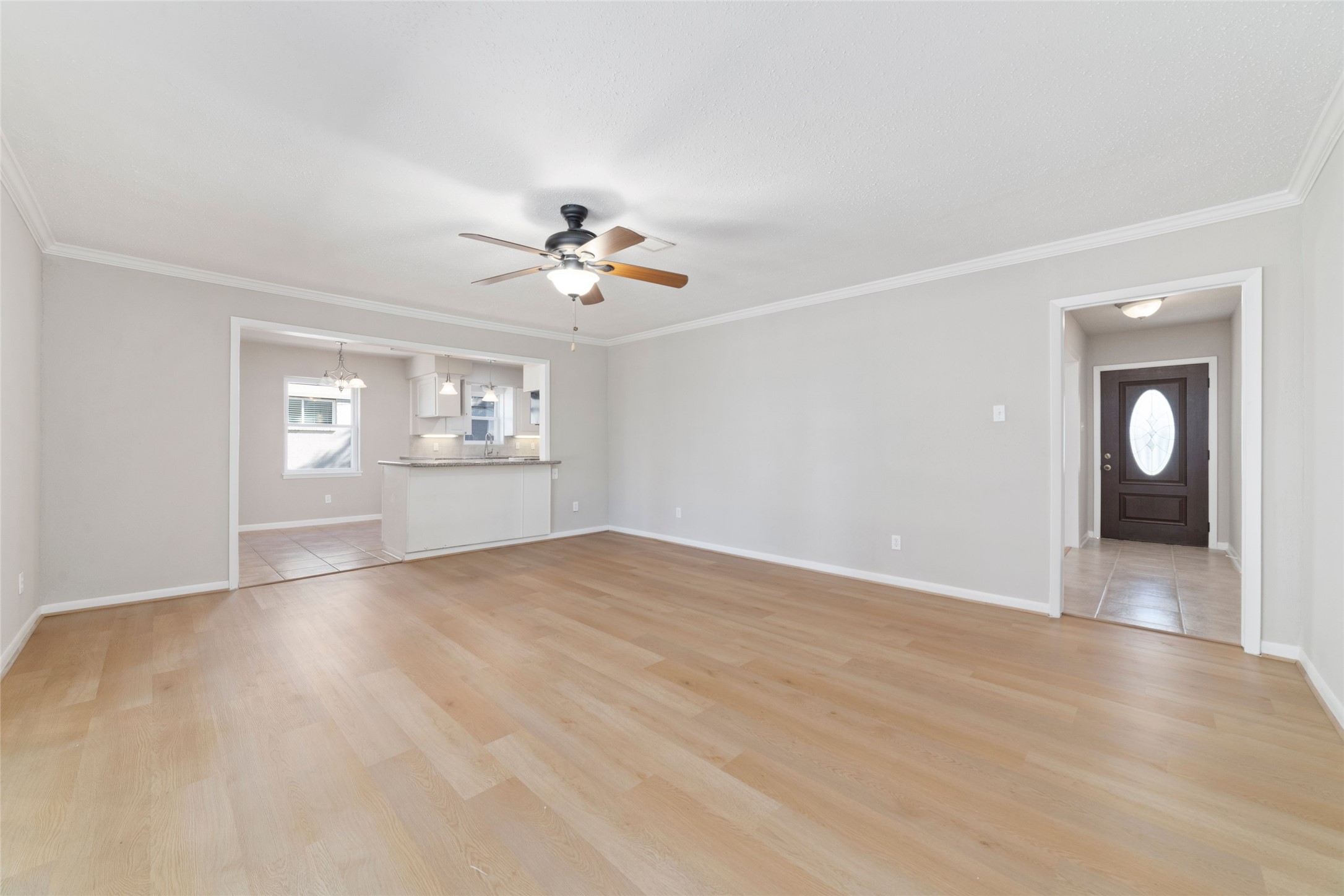 11426 Endicott Lane Houston, TX 77035 - Photo 21 of 40 A massive den that does it all. Movie nights, football, or quiet mornings with coffee.