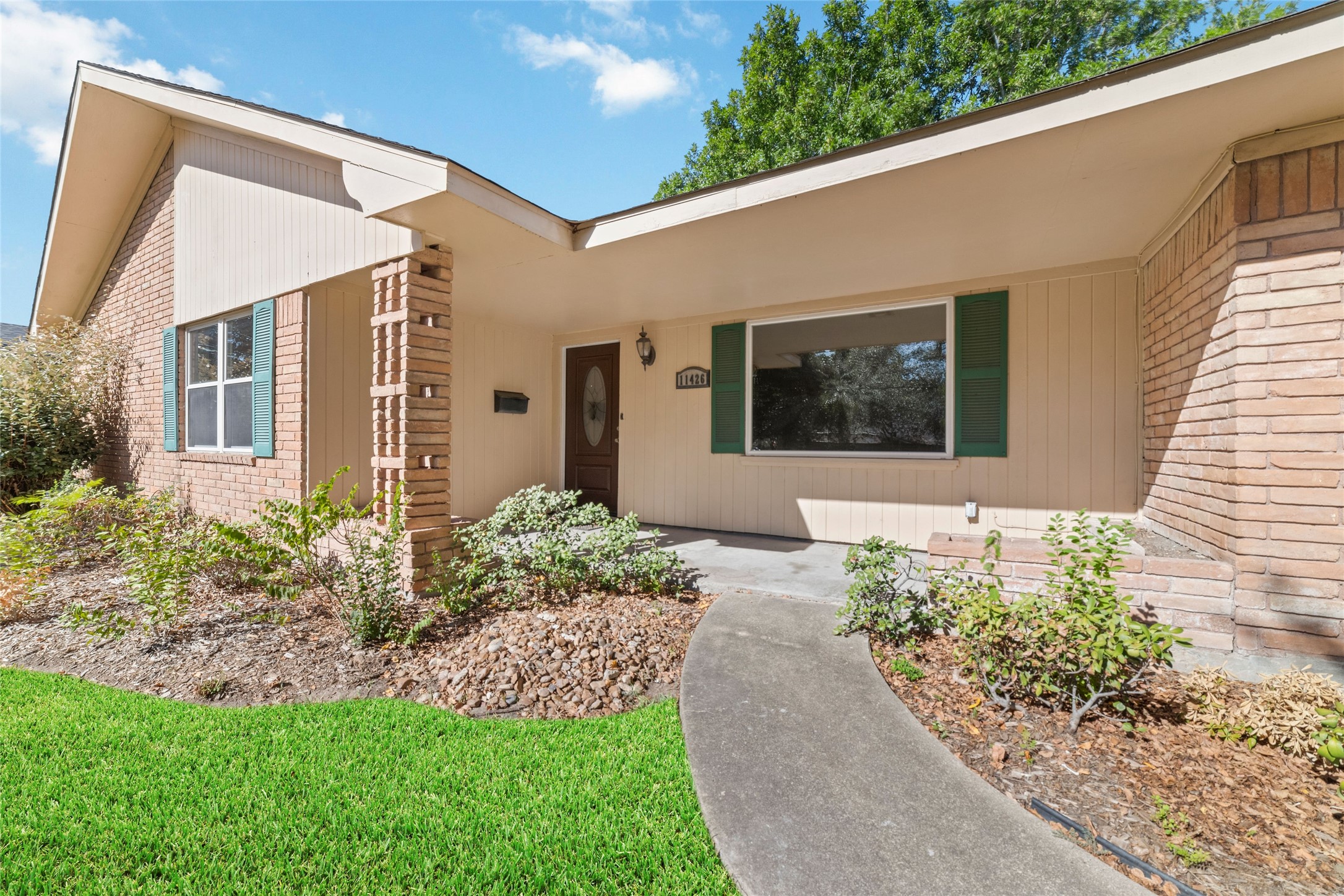 11426 Endicott Lane Houston, TX 77035 - Photo 3 of 40 The front walk just feels good. Simple, classic, and the start of something solid.