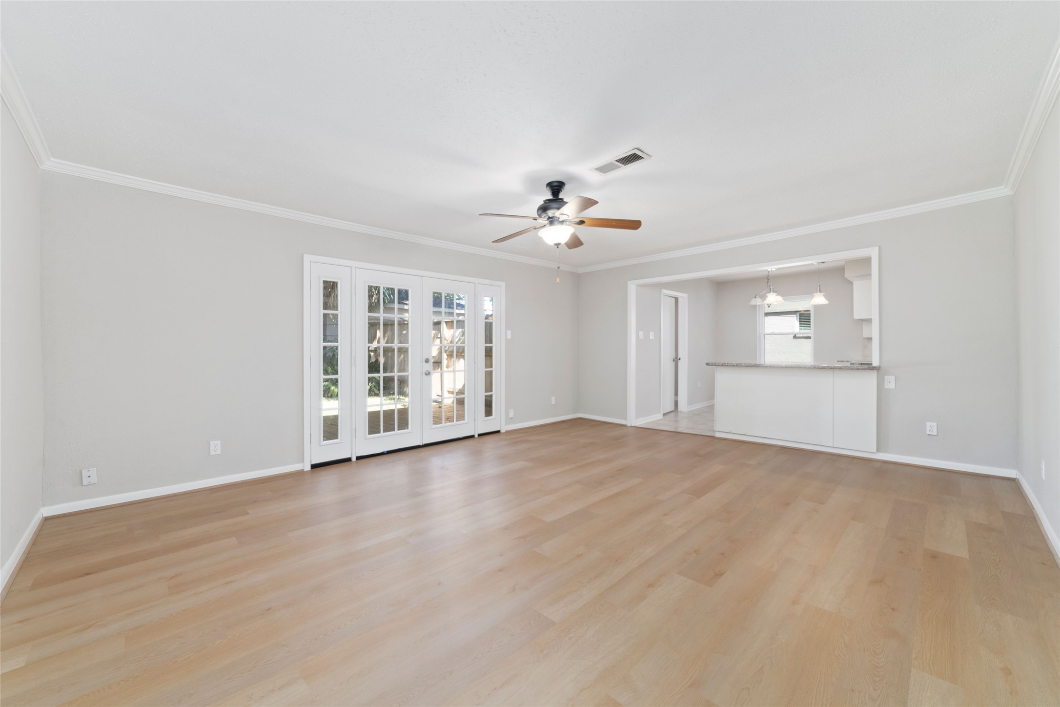 11426 Endicott Lane Houston, TX 77035 - Photo 6 of 40 Large den area with new LVP flooring and recent interior paint gives plenty of space to grow and be comfortable for years to come.