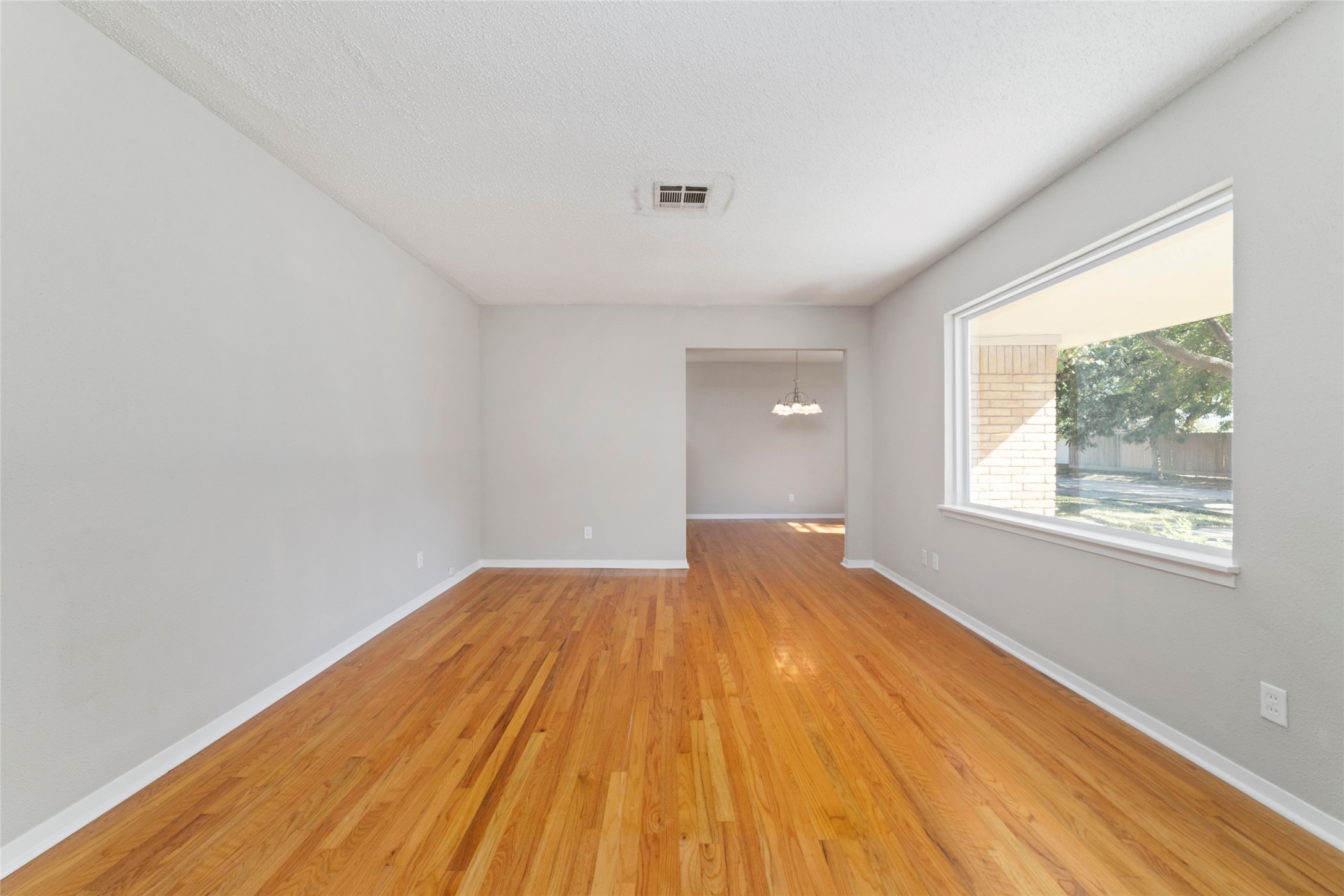 11426 Endicott Lane Houston, TX 77035 - Photo 8 of 40 View of the sizable formals with original hardwood flooring and recent paint.