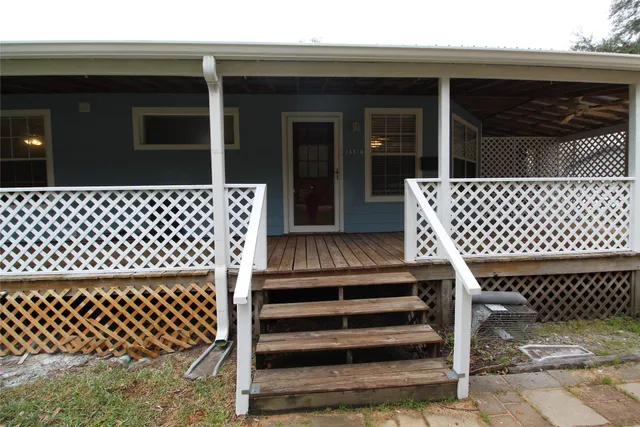 a view of house with yard