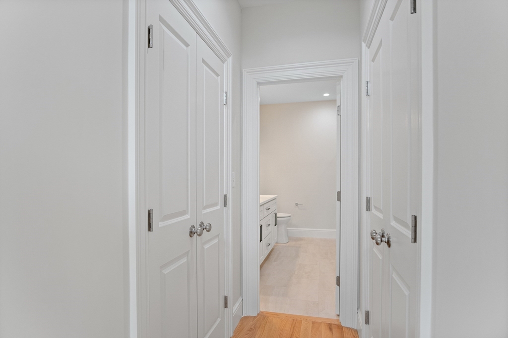 18 Talbot Lane, Unit 18 Reading, MA 01867 - Photo 19 of 33 a view of a bathroom from a hallway