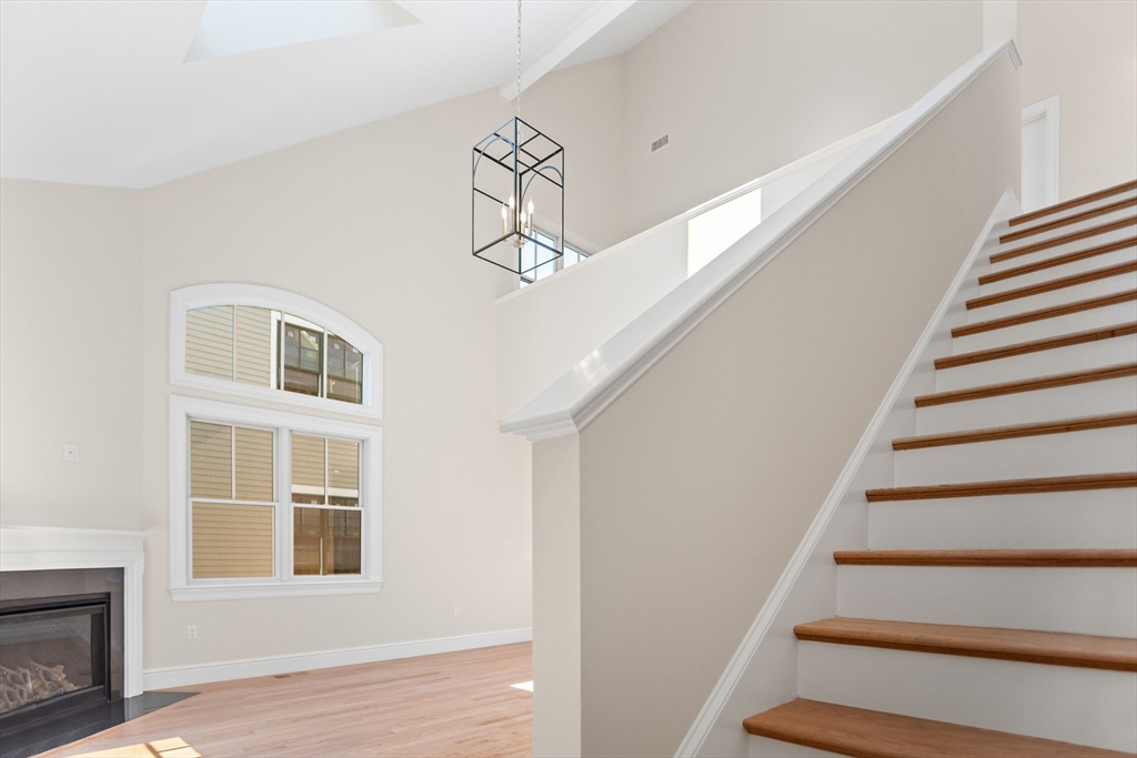 18 Talbot Lane, Unit 18 Reading, MA 01867 - Photo 21 of 33 a view of entryway and hall with wooden floor