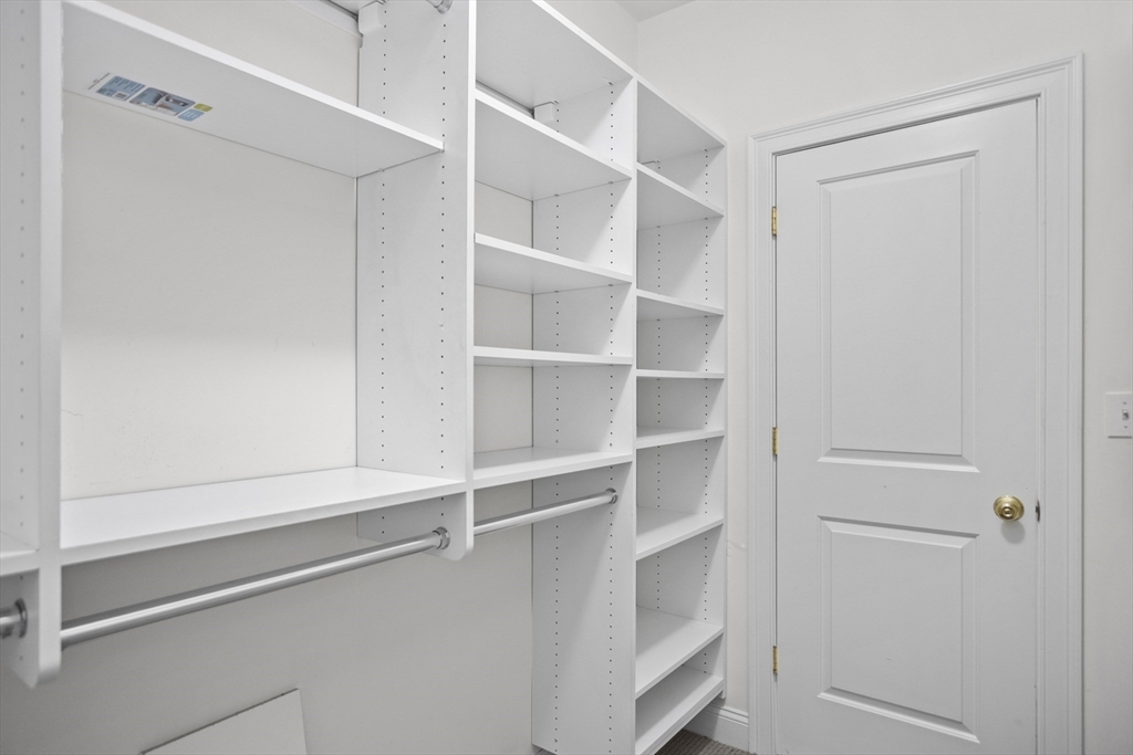 18 Talbot Lane, Unit 18 Reading, MA 01867 - Photo 23 of 33 a view of an empty walk in closet