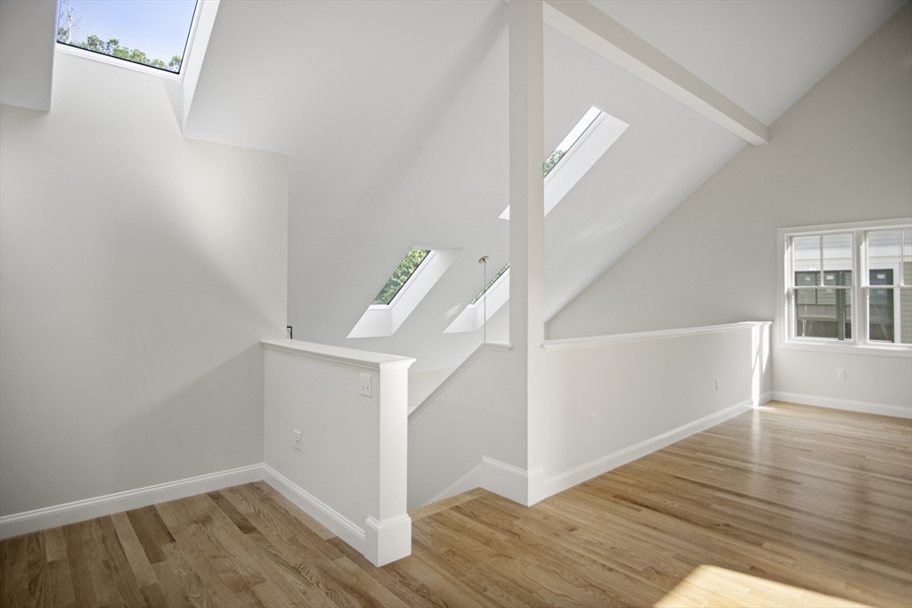 18 Talbot Lane, Unit 18 Reading, MA 01867 - Photo 24 of 33 a view of entryway with wooden floor
