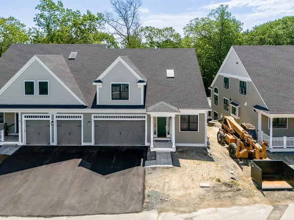 a aerial view of a house with a yard