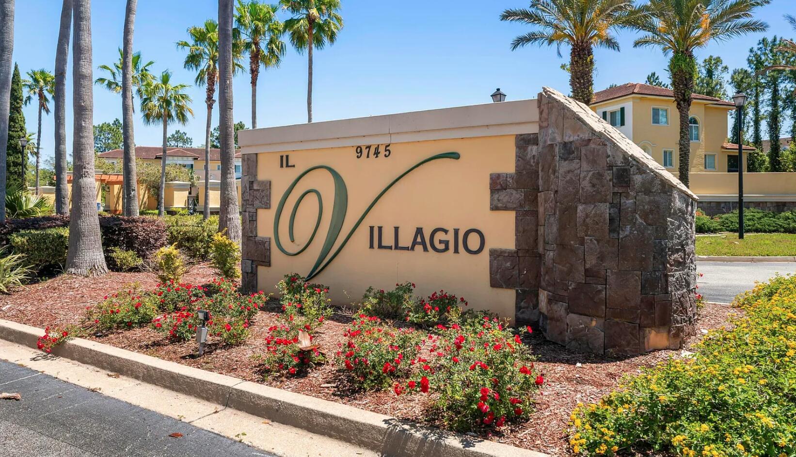 a sign that is in front of flowers