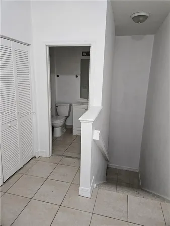 a view of a hallway with closet