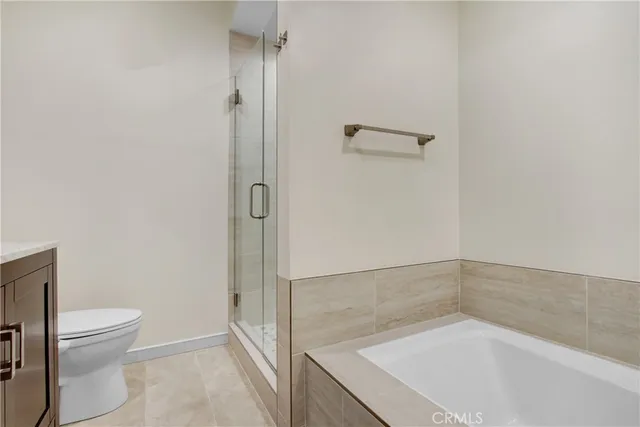 a bathroom with a bathtub and a toilet