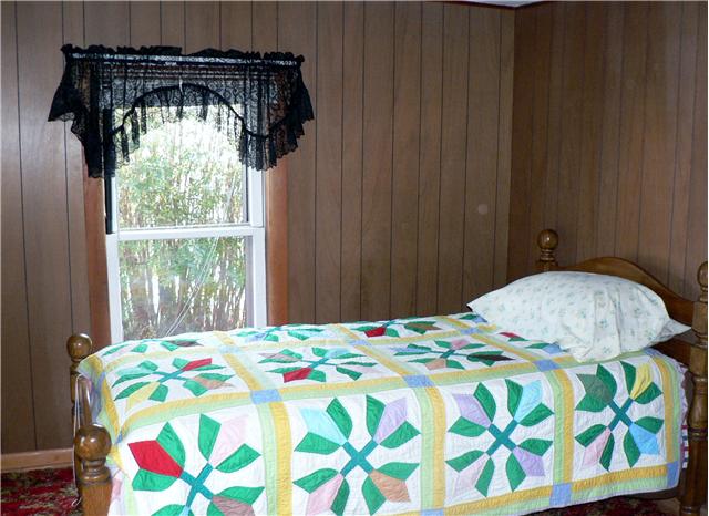 219 Summitville Road Manchester, TN 37355 - Photo 12 of 13 Another spacious bedroom with paneled walls.