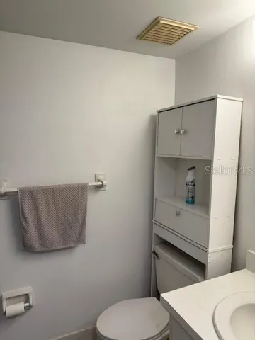 a bathroom with a toilet and a sink