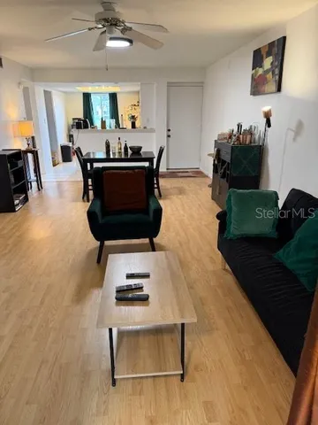 a living room with furniture and a table