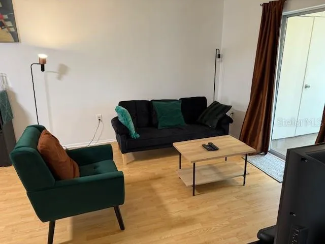 a living room with furniture and a window