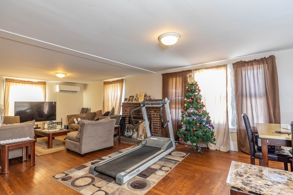 48 West Broadway Gardner, MA 01440 - Photo 14 of 21 a living room with furniture and a flat screen tv