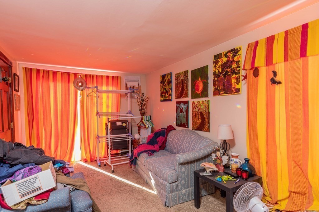 48 West Broadway Gardner, MA 01440 - Photo 16 of 21 a living room with furniture and a window