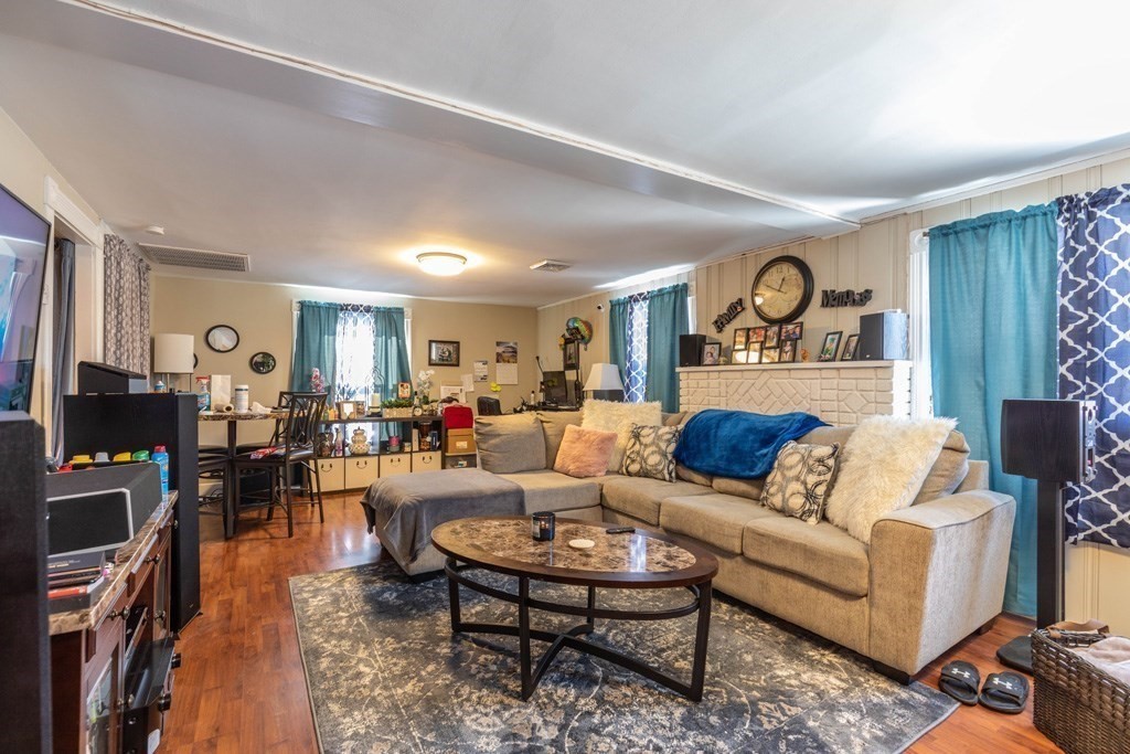 48 West Broadway Gardner, MA 01440 - Photo 5 of 21 a living room with furniture and a flat screen tv
