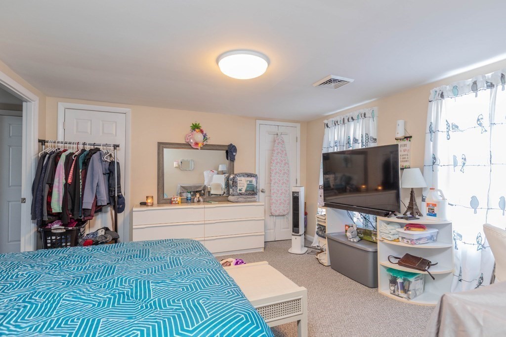 48 West Broadway Gardner, MA 01440 - Photo 8 of 21 a living room with furniture and a flat screen tv