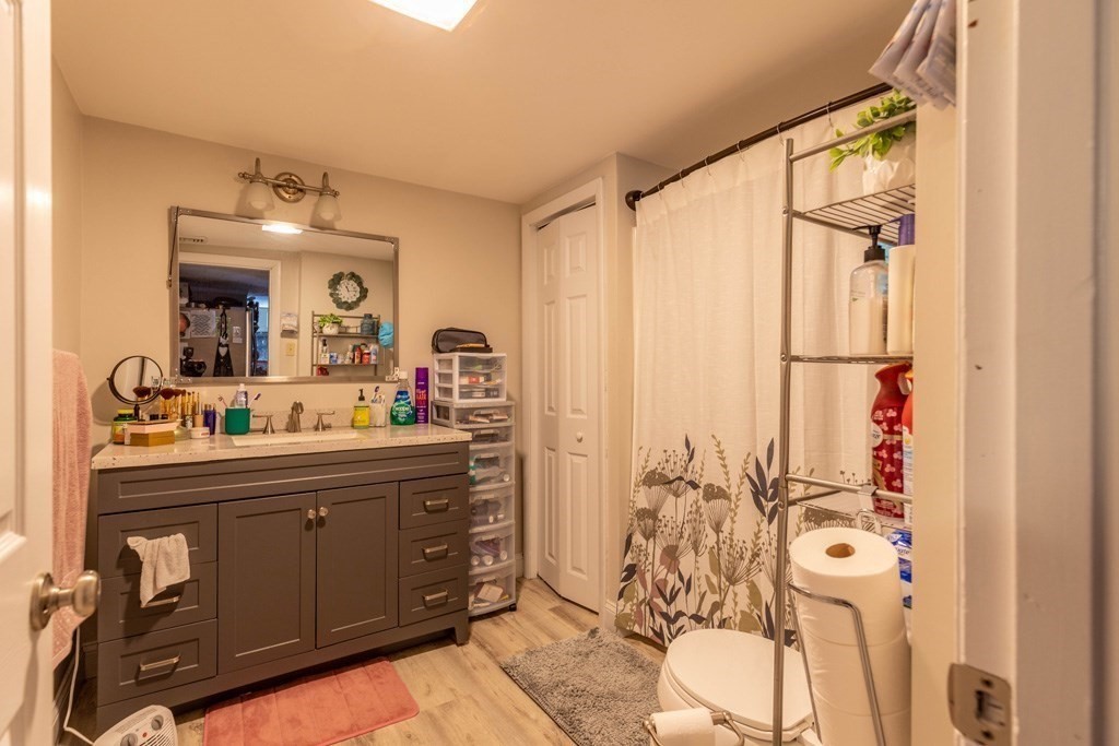 48 West Broadway Gardner, MA 01440 - Photo 10 of 21 a bathroom with a sink mirror and a shower