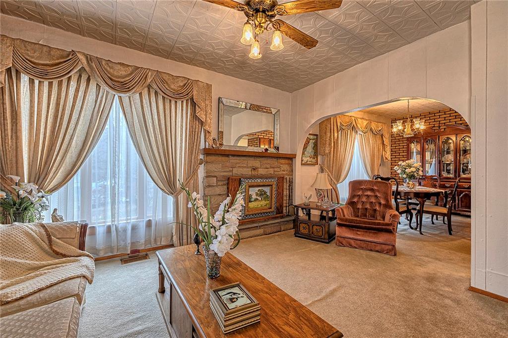 111 Dixonville Road Clymer, PA 15728 - Photo 12 of 27 a living room with furniture a dining table and chairs with wooden floor