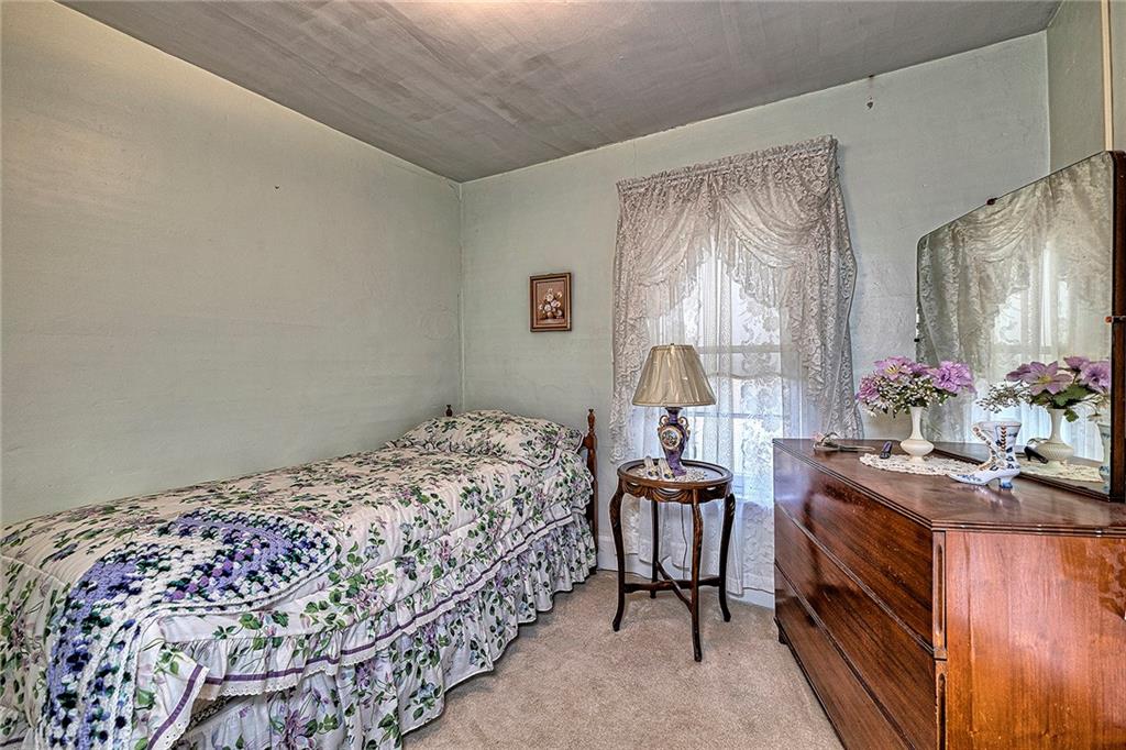 111 Dixonville Road Clymer, PA 15728 - Photo 19 of 27 a bedroom with a bed and dresser