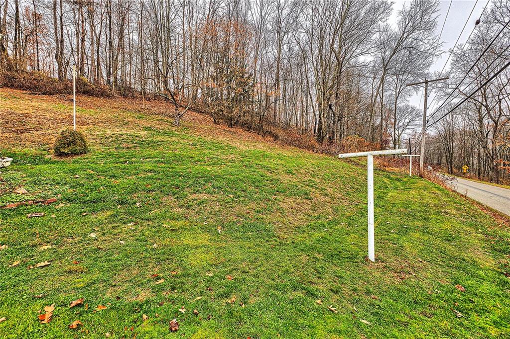 111 Dixonville Road Clymer, PA 15728 - Photo 27 of 27 a backyard of a house with lots of green space