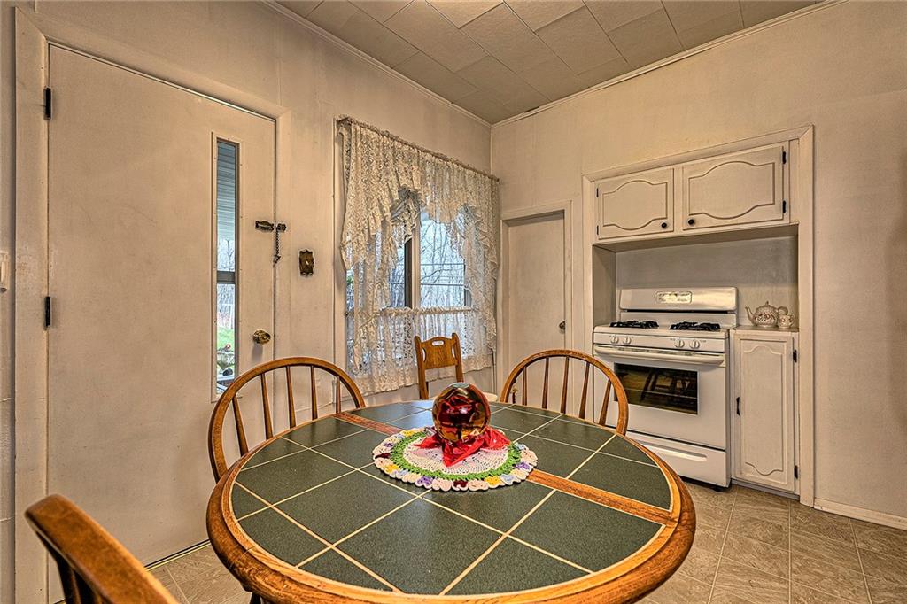 111 Dixonville Road Clymer, PA 15728 - Photo 7 of 27 a room with furniture and a mirror