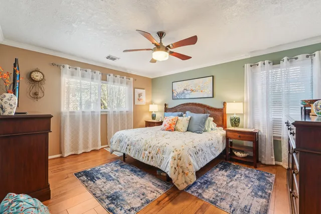 a bedroom with a large bed and a window