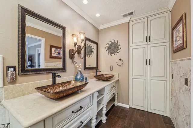 a spacious bathroom with a granite countertop sink and a mirror