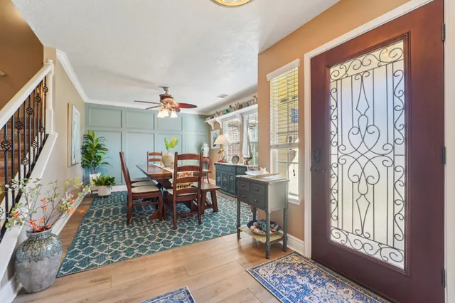 a dining room with furniture and window