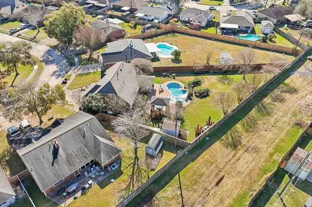 a view of swimming pool with outdoor seating and plants