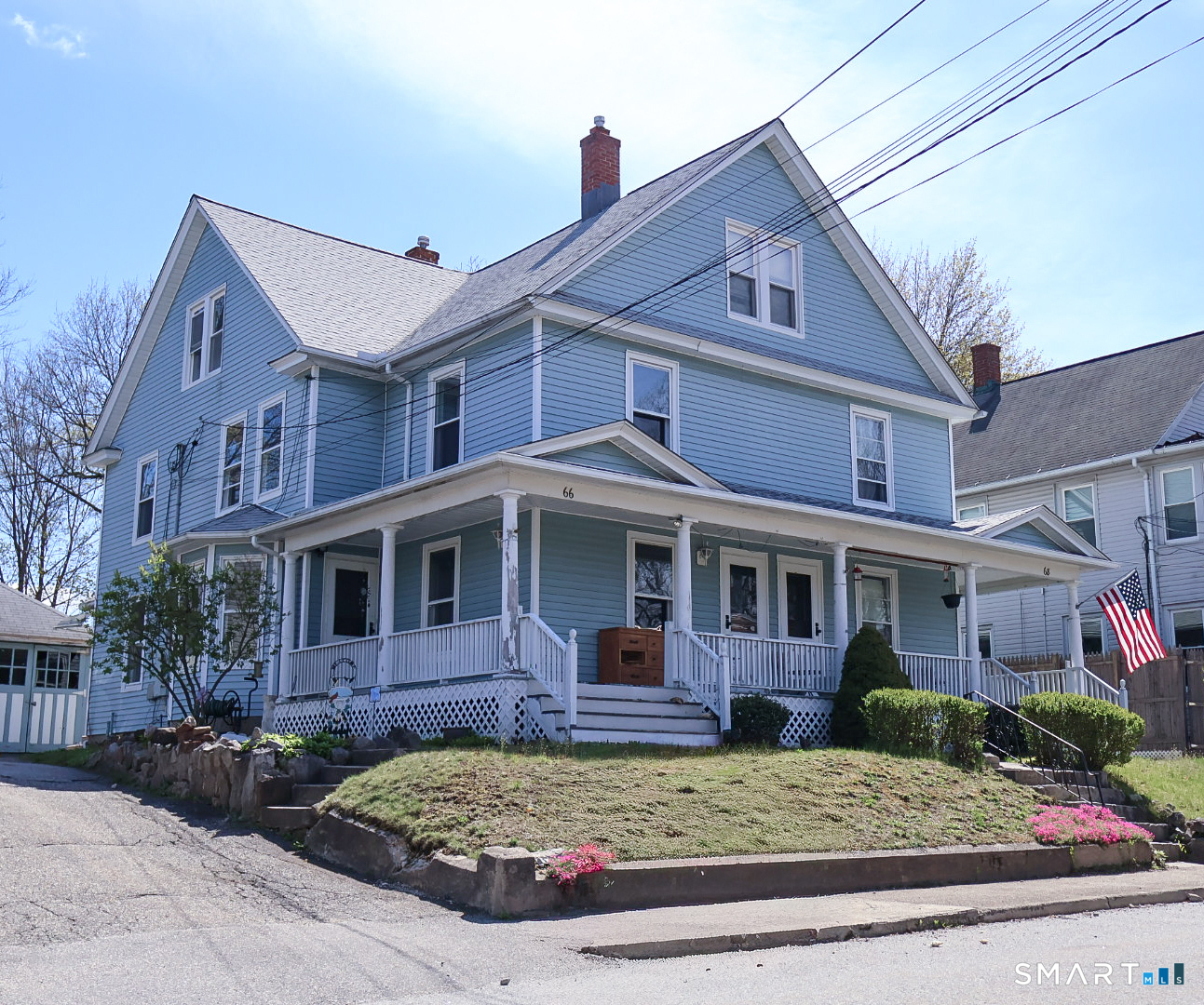 66 Forest Court Torrington, CT 06790 - Photo 1 of 18 a view of a white house with large windows next to a yard