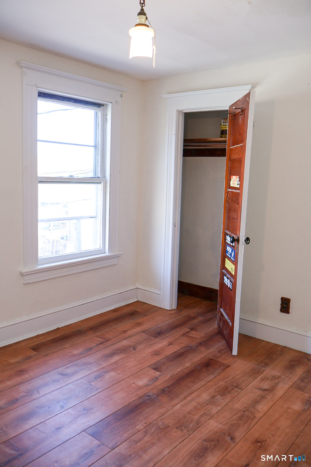 66 Forest Court Torrington, CT 06790 - Photo 12 of 18 an empty room with wooden floor and closet