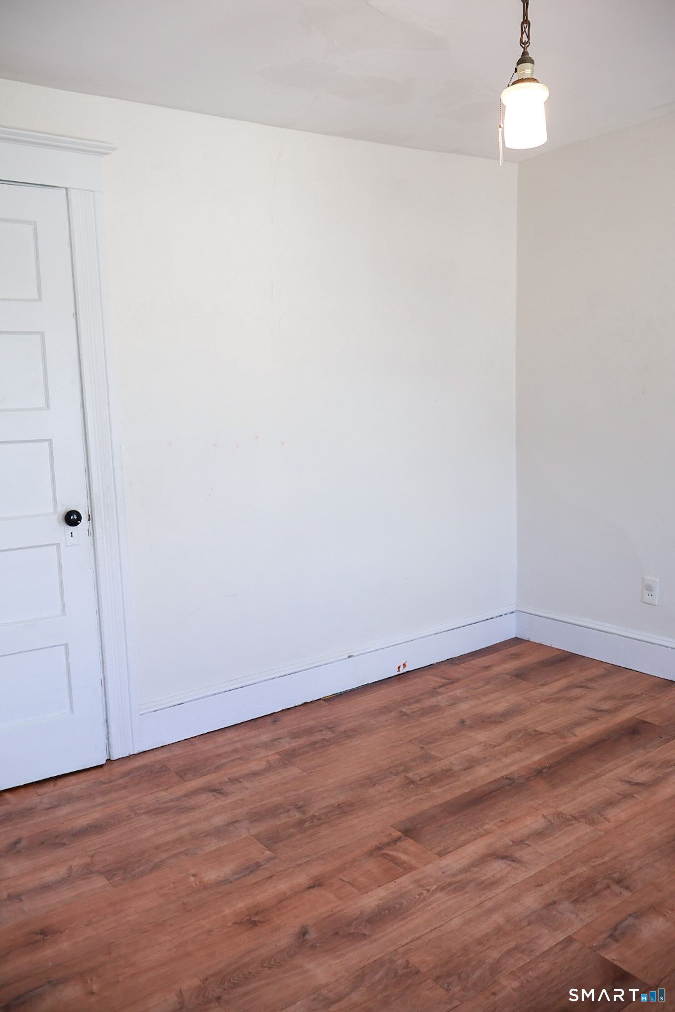 66 Forest Court Torrington, CT 06790 - Photo 13 of 18 a view of an empty room with wooden floor