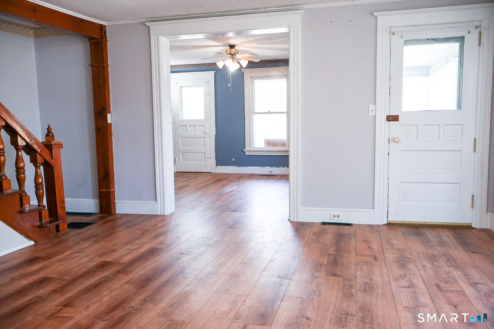 66 Forest Court Torrington, CT 06790 - Photo 6 of 18 a view of an empty room with wooden floor and a window