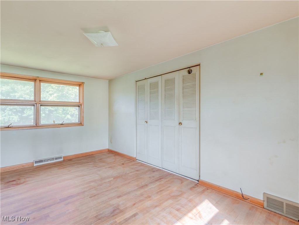 926 Alfred Road Akron, OH 44306 - Photo 11 of 14 Unfurnished bedroom featuring a closet and light hardwood / wood-style floors