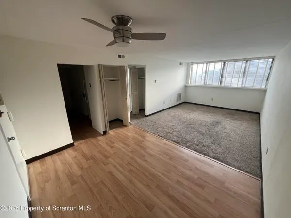 a view of an empty room with a window