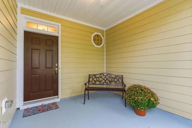 a view of a door and chair in front of a door