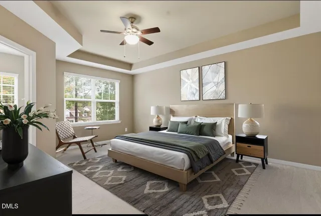 a view of an empty room with a ceiling fan