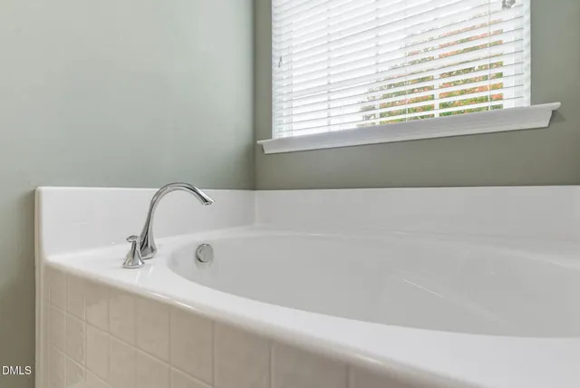 a view of balcony with floor to ceiling windows and wooden fence