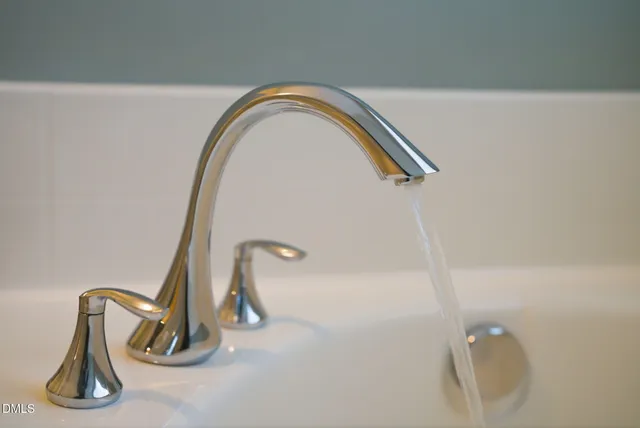 a view of a street with chairs