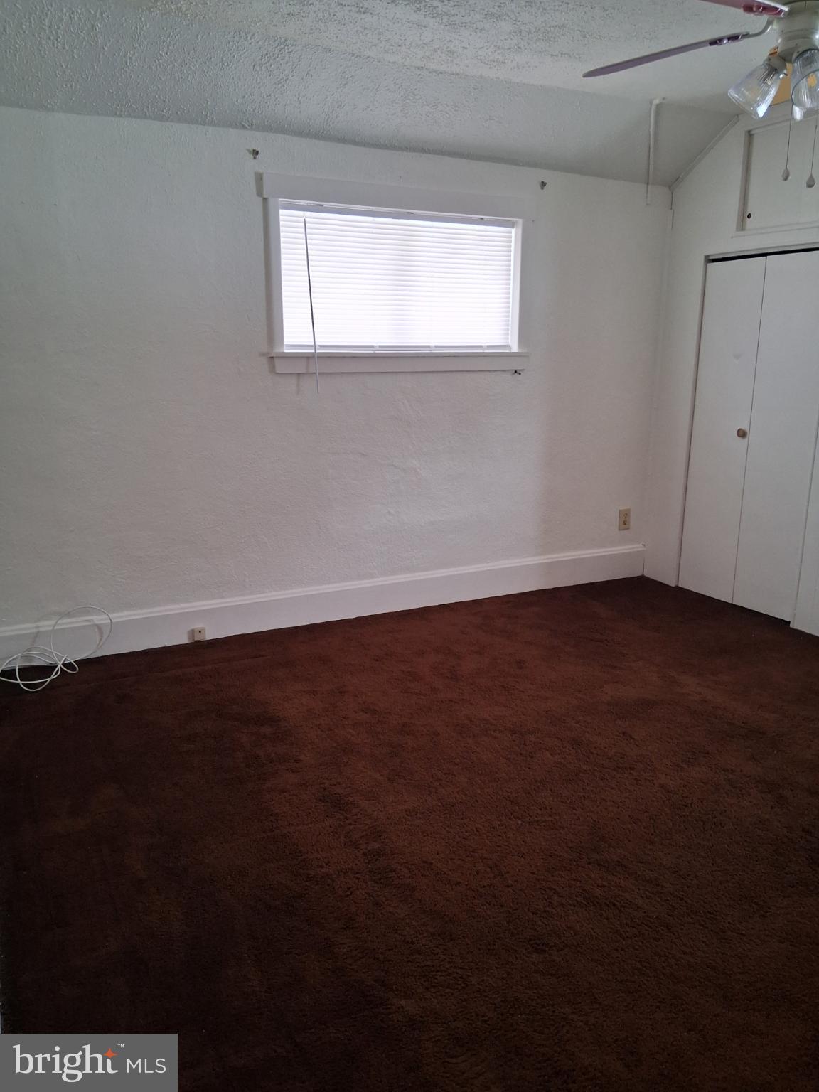265 View Street Johnstown, PA 15902 - Photo 27 of 64 a view of an empty room with wooden floor and a window