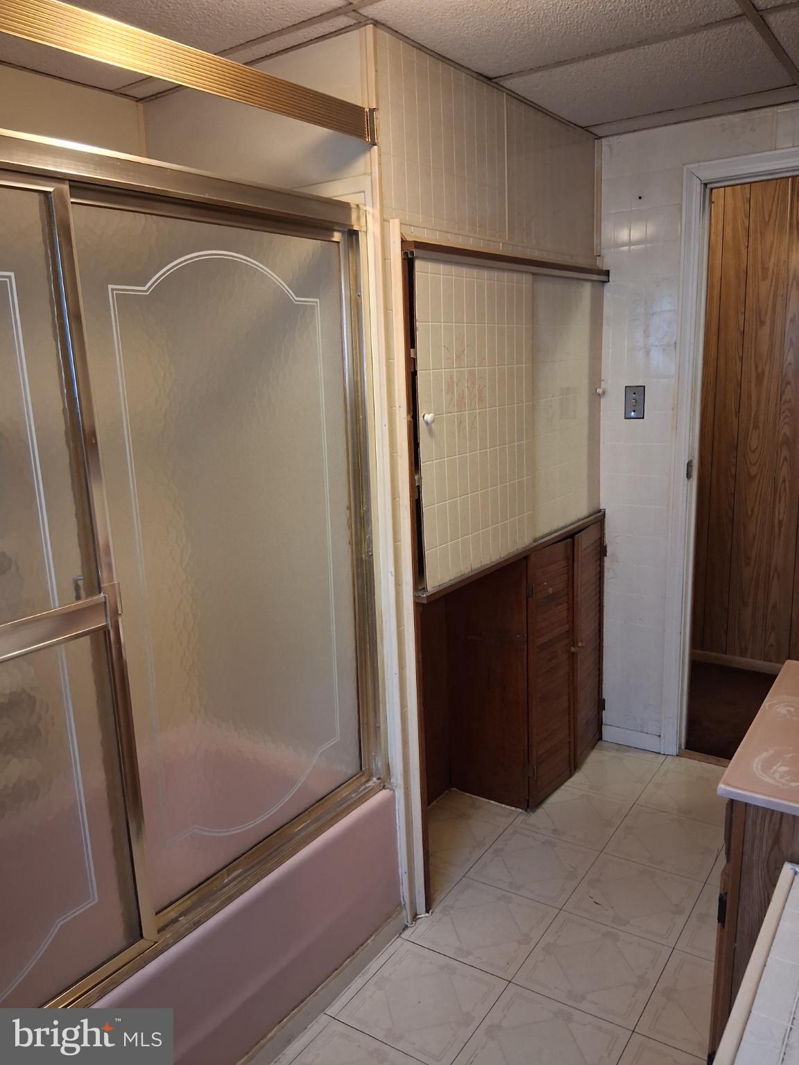 265 View Street Johnstown, PA 15902 - Photo 33 of 64 a bathroom with a glass shower door and a sink