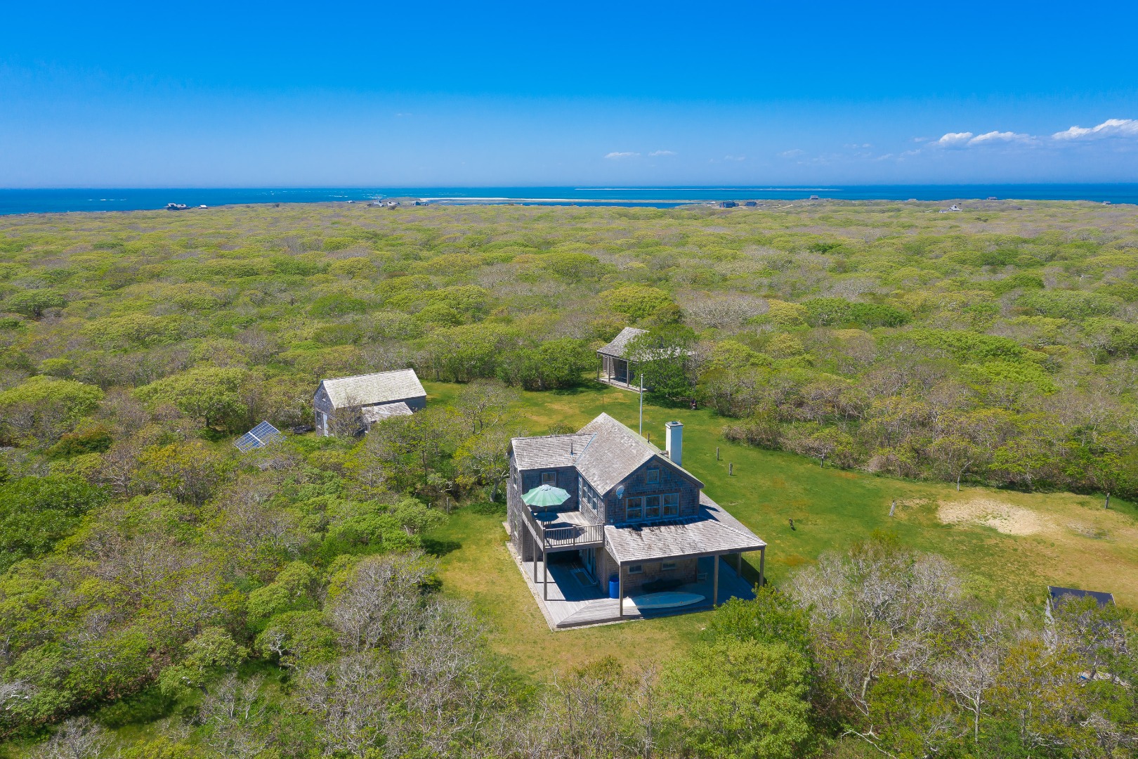 94-21 Tuckernuck Nantucket, MA 02554 - Photo 2 of 20 a view of a yard with a house