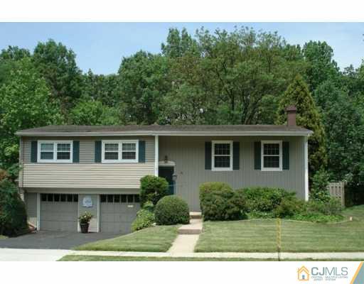 78 Harmon Road Edison, NJ 08837 - Photo 1 of 8 a view of a house with a backyard