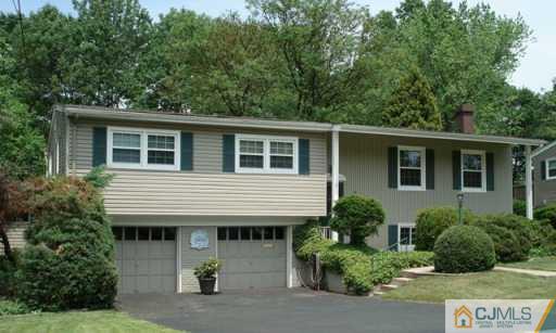 78 Harmon Road Edison, NJ 08837 - Photo 2 of 8 a view of a house with a yard and potted plants