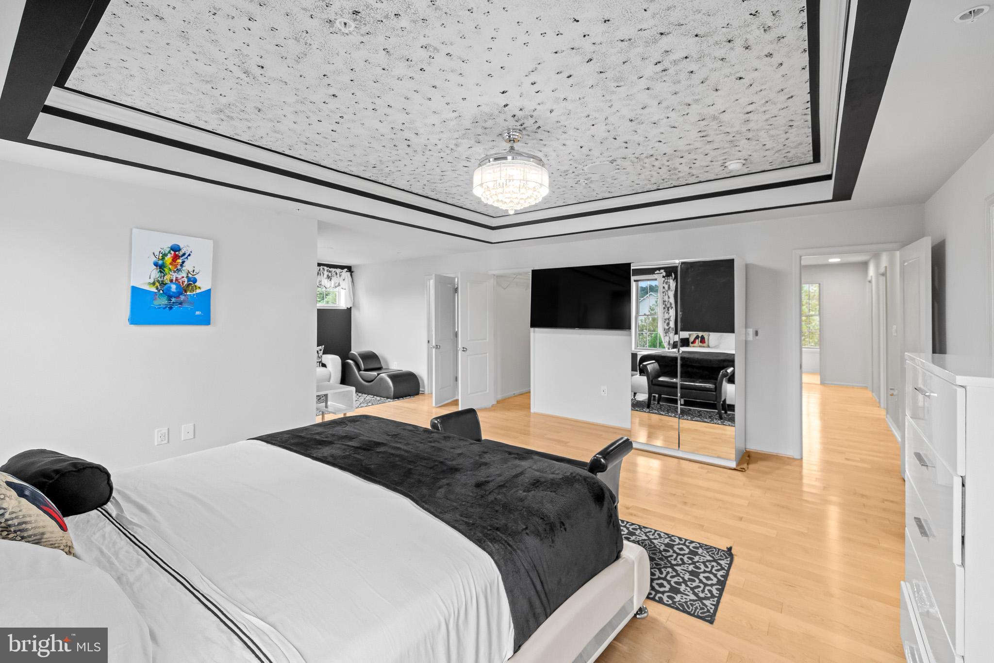 1116 Autumn Brook Avenue Silver Spring, MD 20906 - Photo 35 of 67 a spacious bedroom with a bed and a view of kitchen