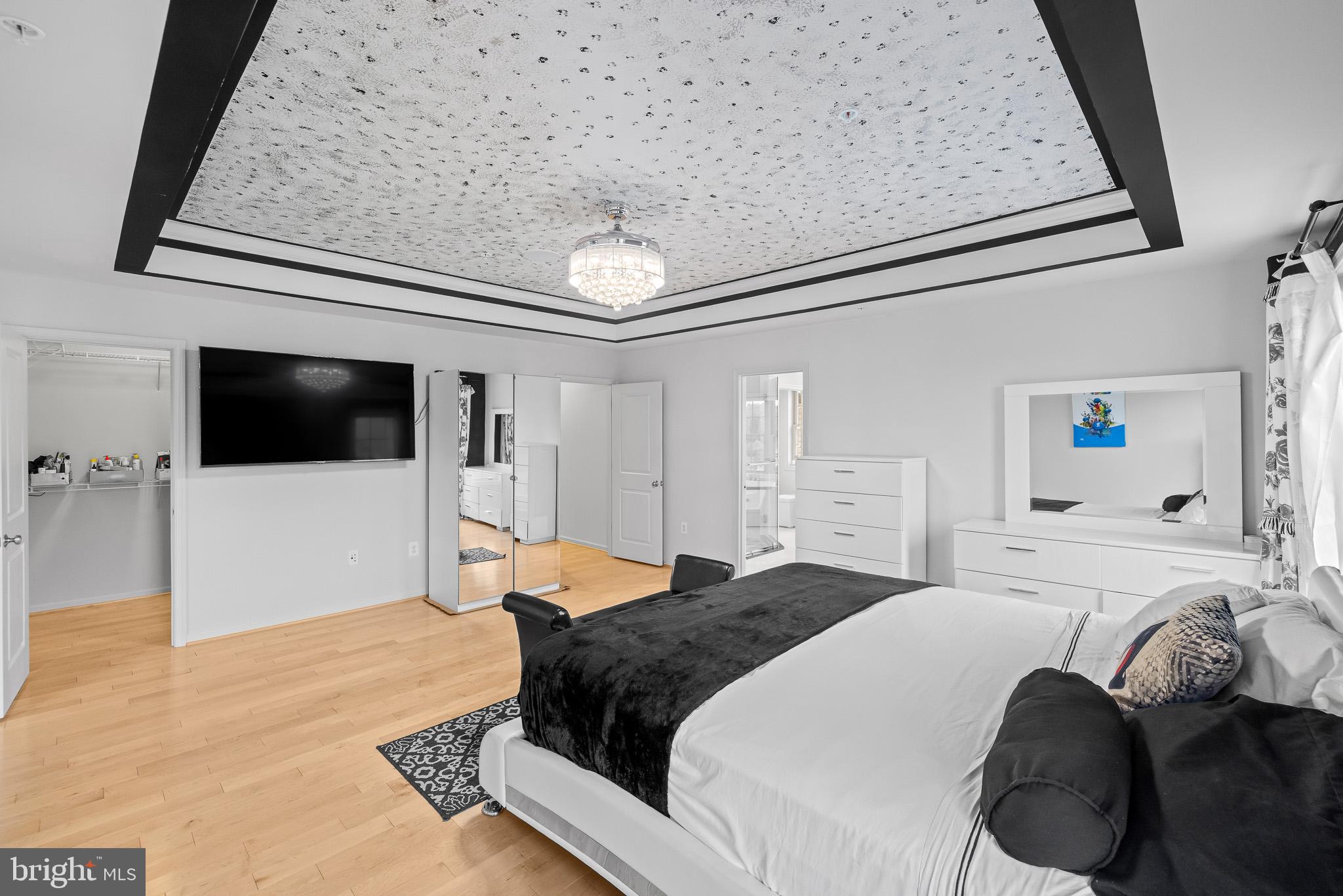 1116 Autumn Brook Avenue Silver Spring, MD 20906 - Photo 36 of 67 a bedroom with a bed and a flat screen tv