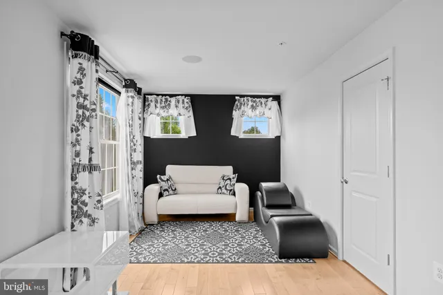 a bathroom with a glass shower door and a sink